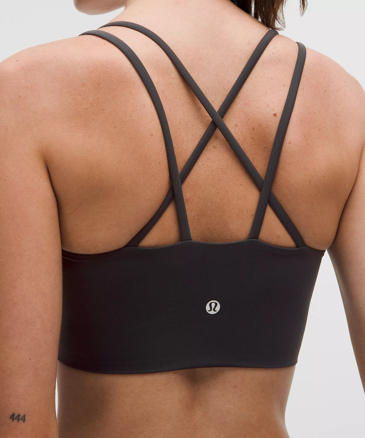 Black Like a Cloud Longline Bra with criss-cross straps and a logo.