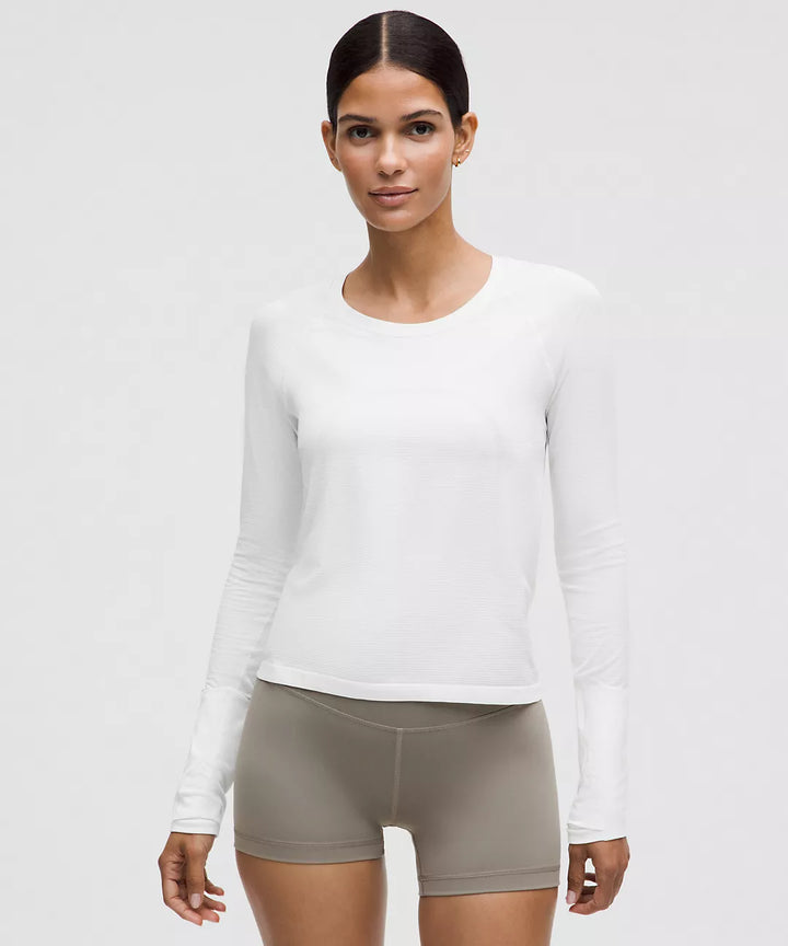 White long-sleeve athletic shirt with a crew neck.