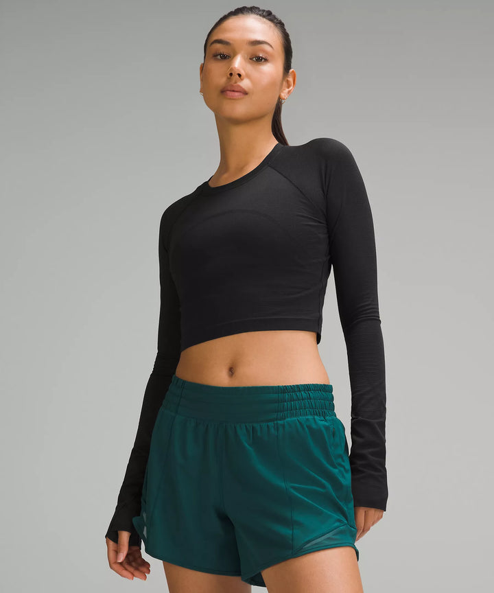 Black cropped long-sleeve shirt with thumbholes.