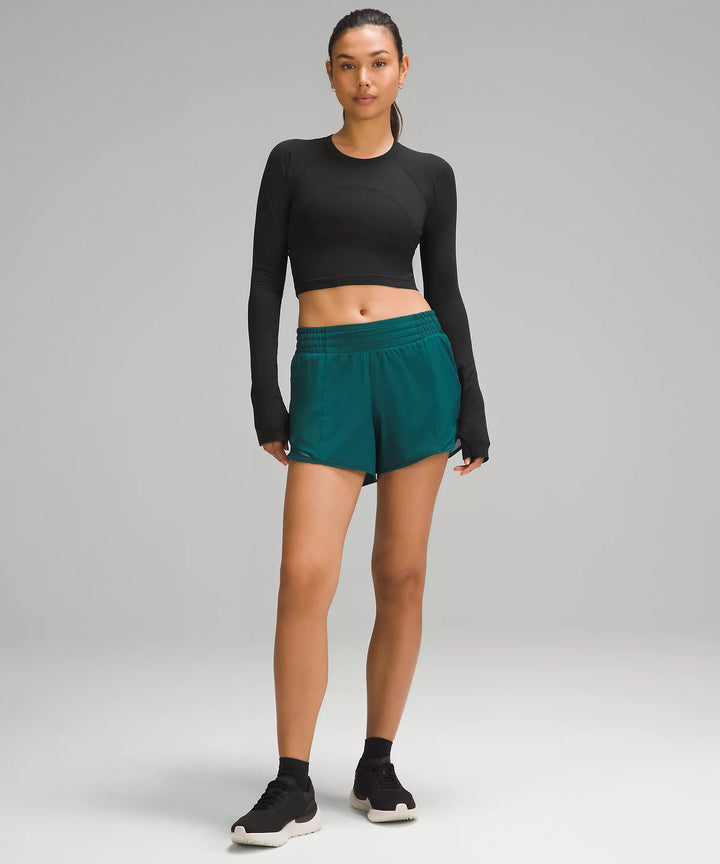 Black cropped long-sleeve shirt with thumbholes.