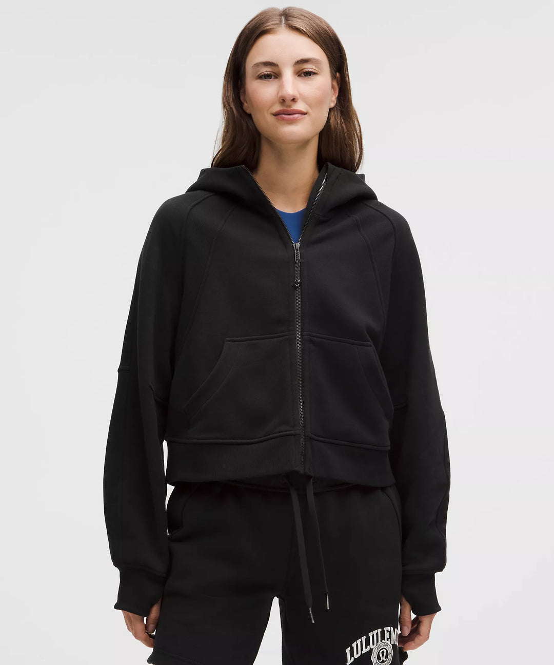Black oversized full-zip hoodie with a relaxed fit and front pockets.