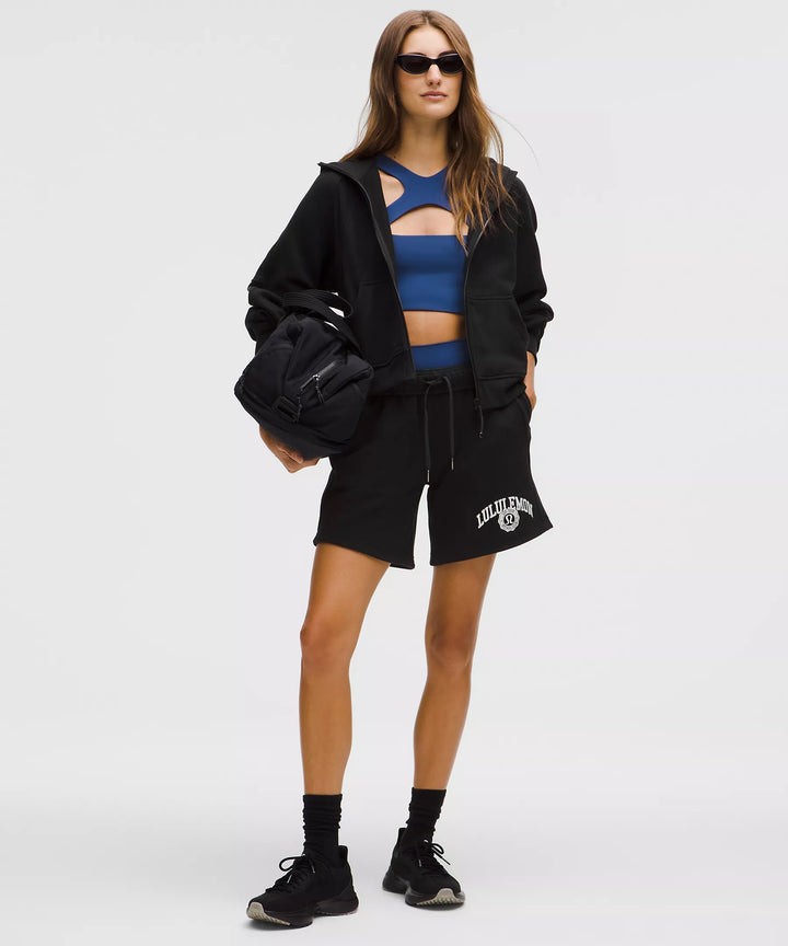 A woman models a black Scuba Oversized Full-Zip Hoodie.