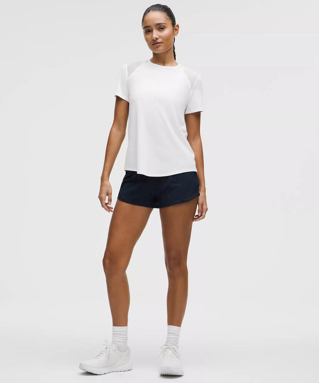 White short-sleeve athletic shirt with mesh shoulder panels.