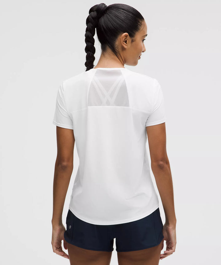 White short-sleeve shirt with mesh back detail.
