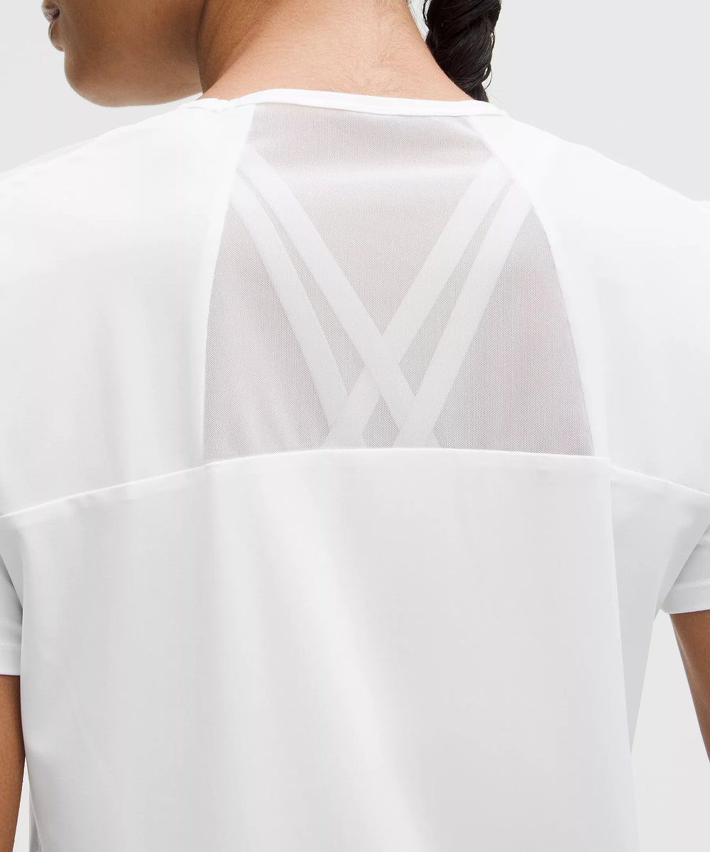 White short-sleeve shirt with mesh back detail.