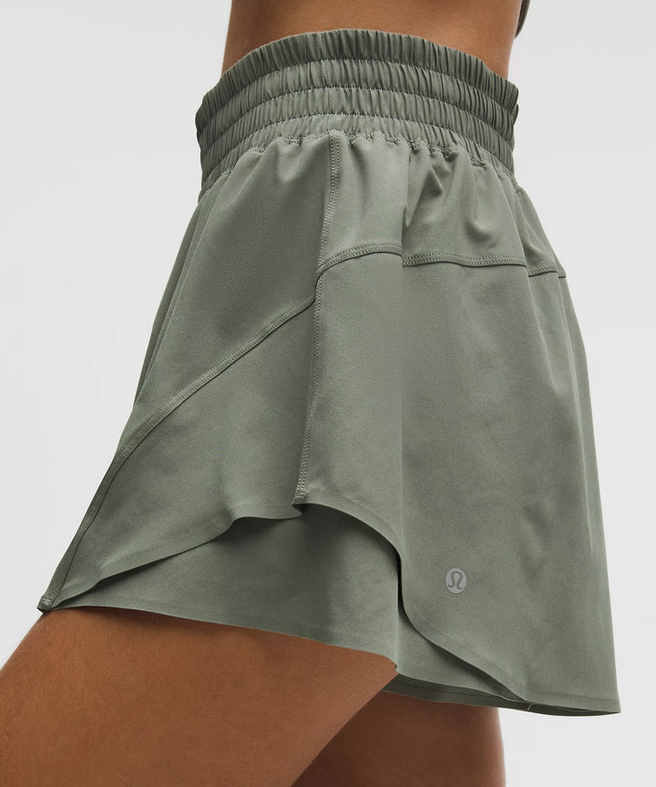 Shake It Out High-Rise Running Short 2.5" in Fog Green with a layered hem.