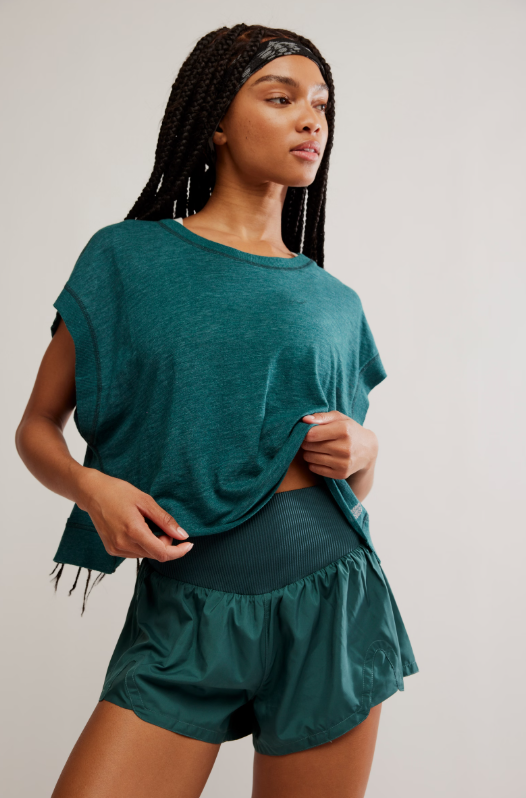 Evergreen shorts with a high-rise knit waistband and relaxed fit.