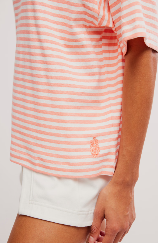 A coral and white striped t-shirt with an embroidered logo.