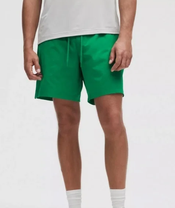 Men's green 7-inch linerless shorts with a drawstring waist.