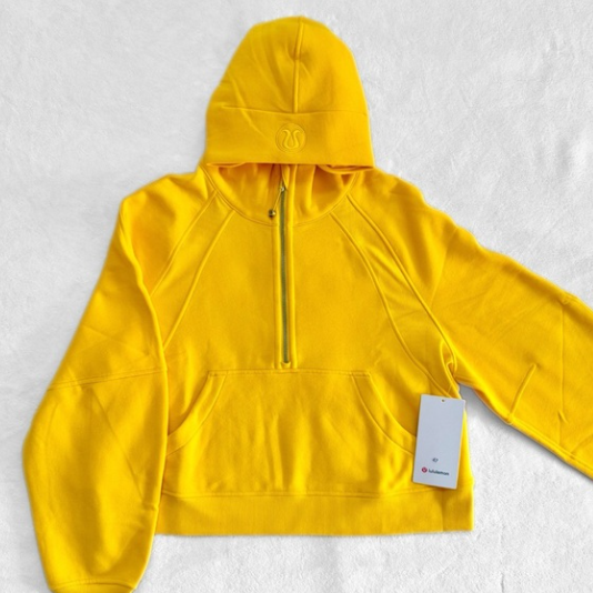 Yellow Lululemon oversized half-zip hoodie with a kangaroo pocket.