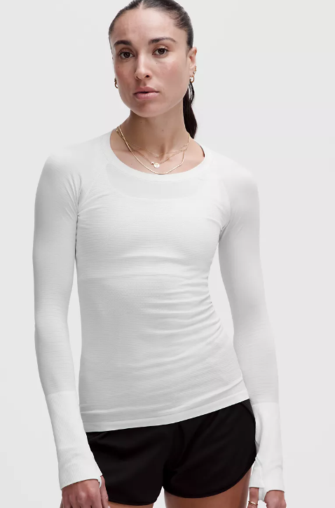 A white seamless long-sleeve top with thumbholes.