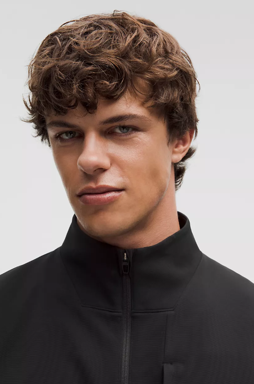 Black Sojourn Jacket with a zippered front and stand-up collar.