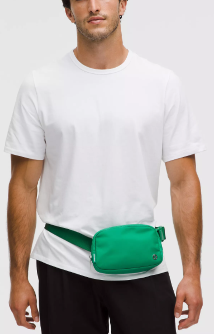 Everywhere Belt Bag 1L in Raceway Green worn by a man.