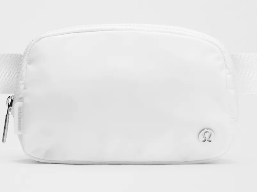 A white Lululemon belt bag with a silver logo and zipper.