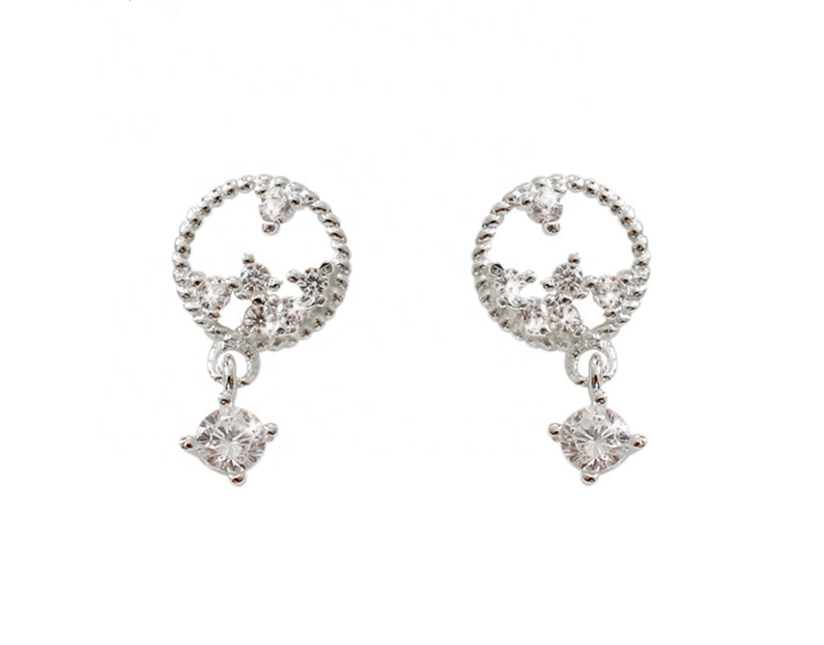 A pair of platinum-plated sterling silver stud earrings with a CZ drop.