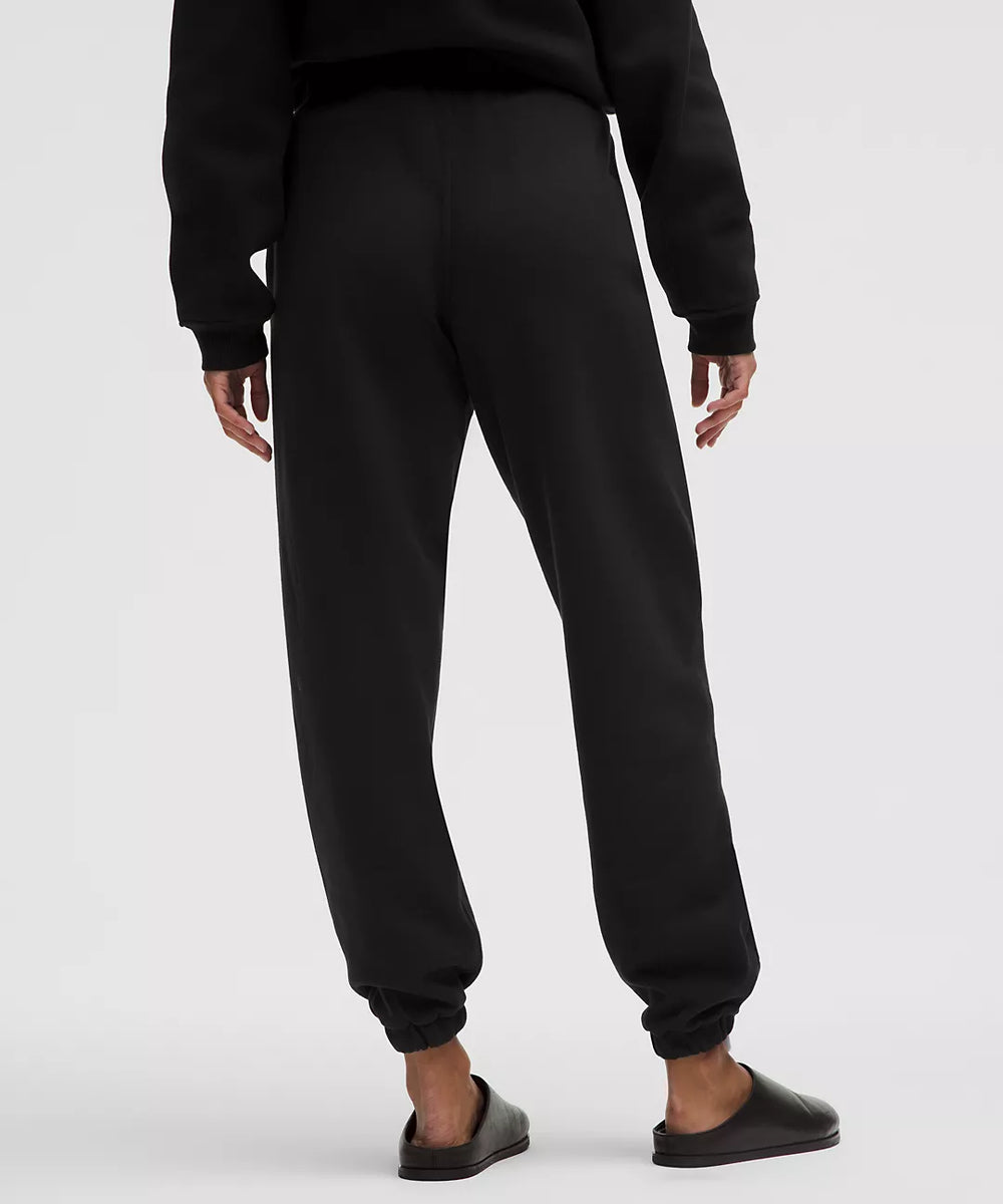 Black mid-rise oversized joggers with cuffed ankles.