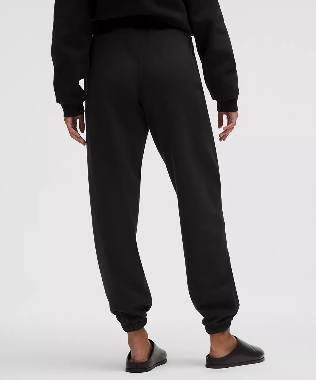 Black mid-rise oversized joggers with cuffed ankles.