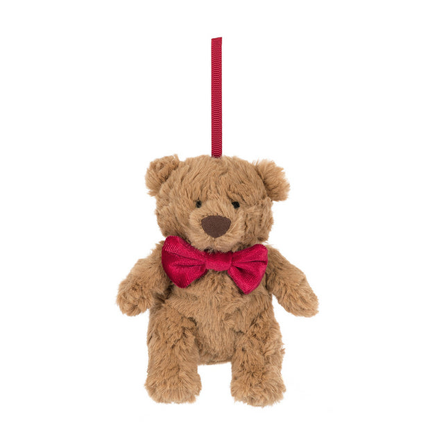 A small brown teddy bear ornament with a red bow tie and hanging loop.