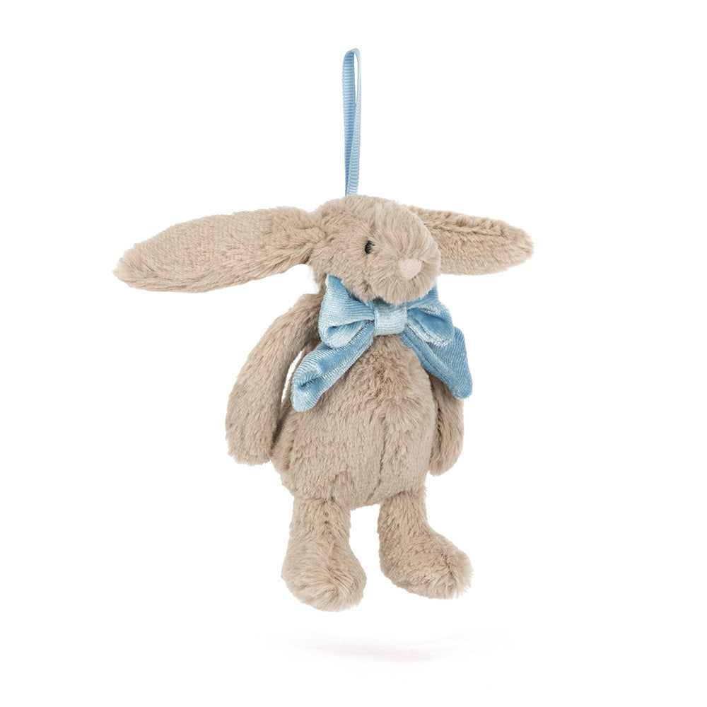A beige bunny ornament with a blue bow and hanging loop.