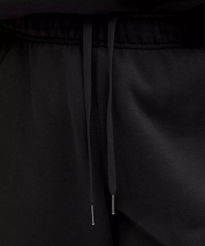 Black scuba mid-rise oversized joggers with drawstring.