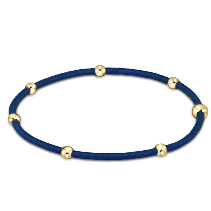 Navy elastic bracelet with gold-filled beads.