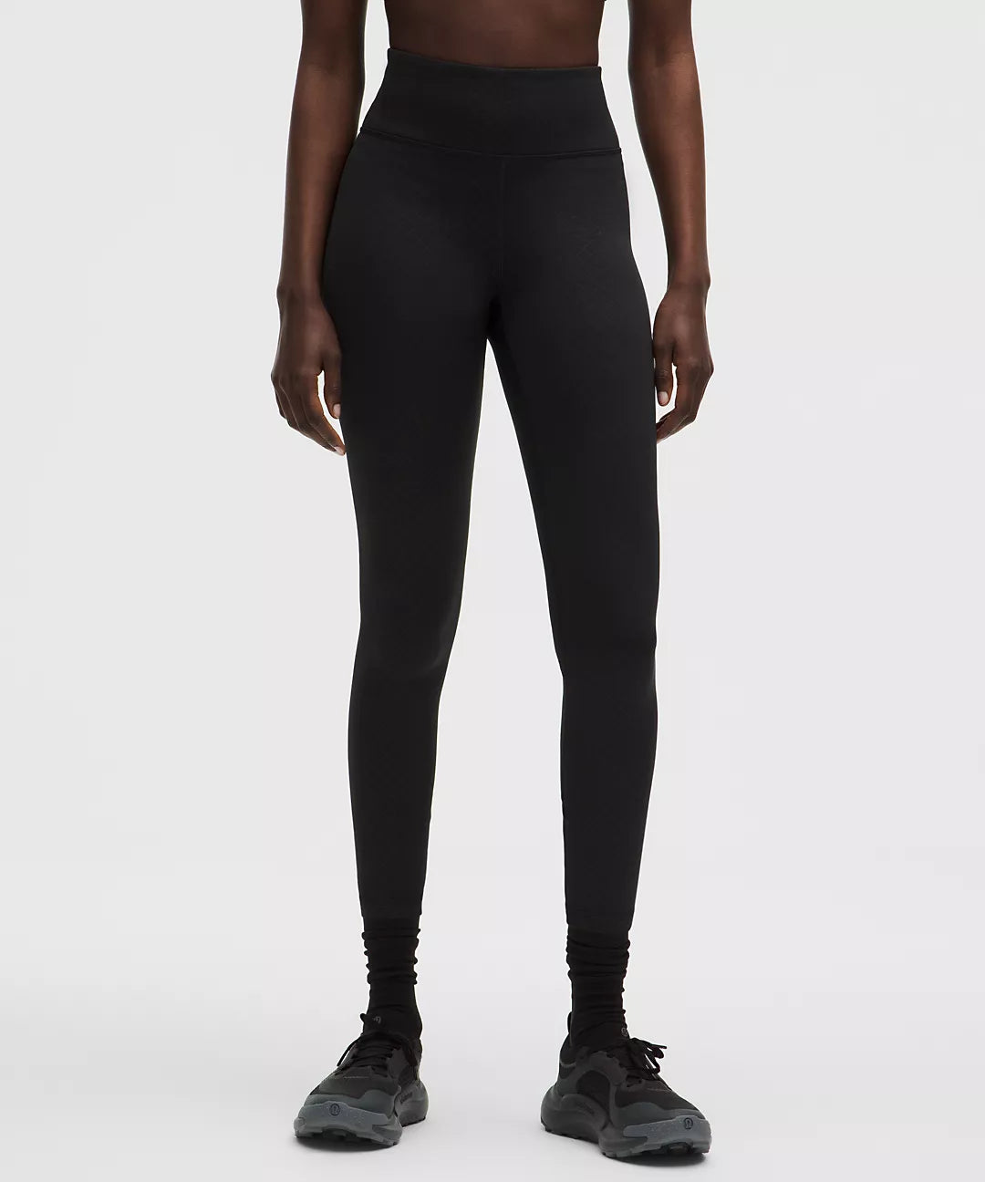 Black fleece high-rise running tights with a 25-inch inseam.