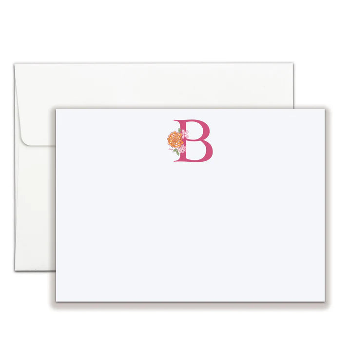 A white flat notecard with a pink initial B and orange floral accents, with a white envelope.