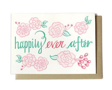 A card with "happily ever after" written in script with floral accents.