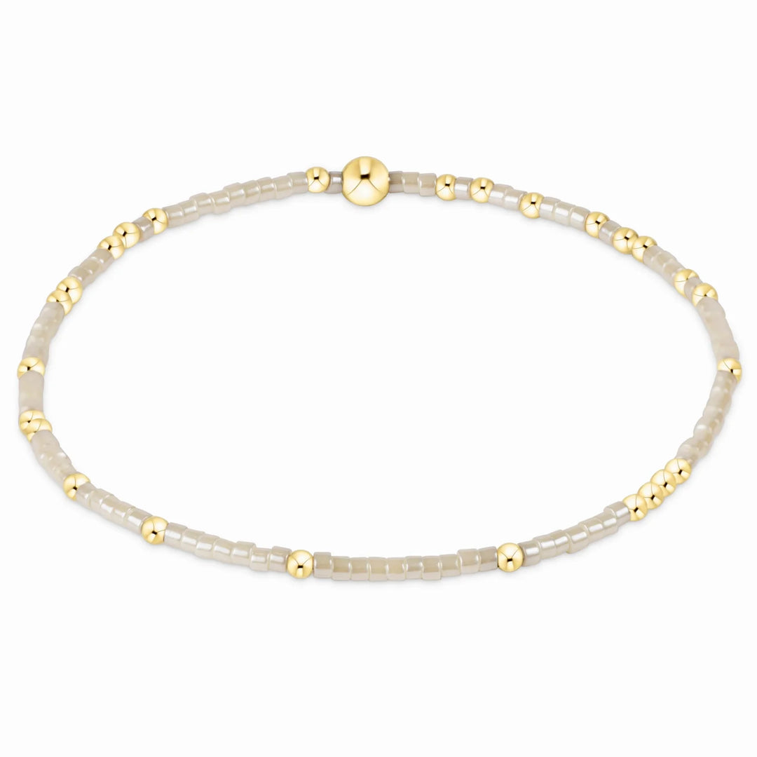Hope Unwritten Bracelet Milkshake with gold beads and translucent beads.