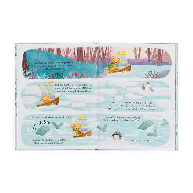 An open children's book shows a bear in a boat on an icy sea, with text and illustrations.