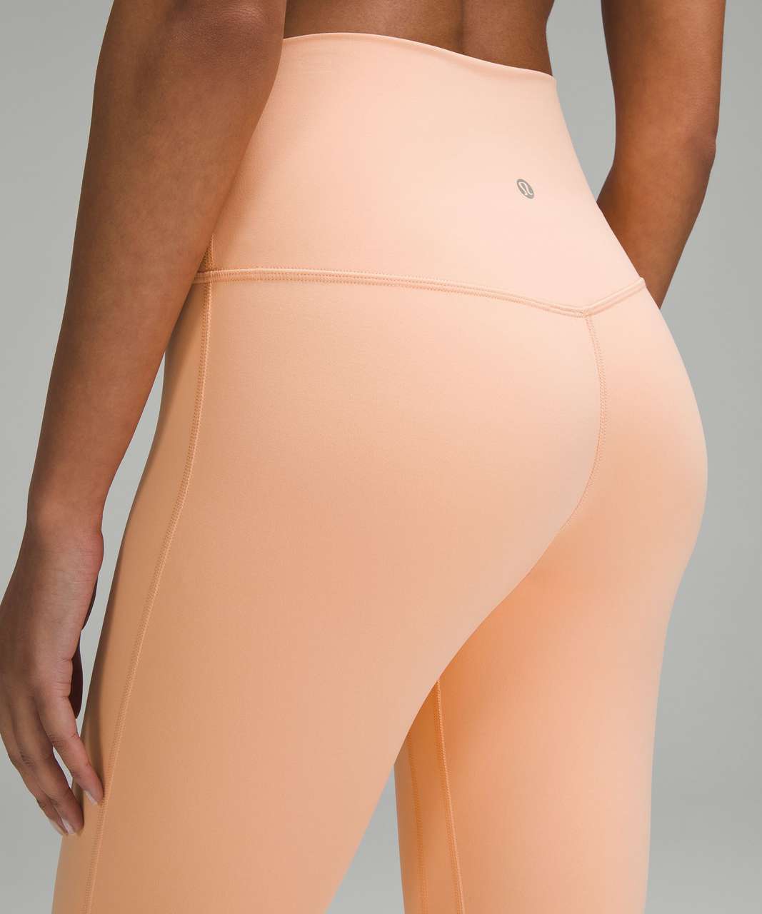 Peach Bellini lululemon Align high-rise 25" leggings.