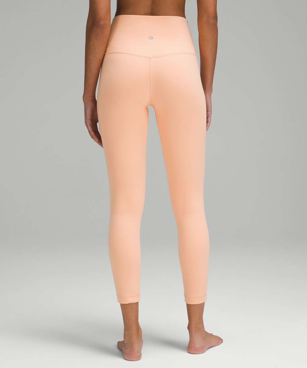 Peach Bellini lululemon Align high-rise 25" leggings.