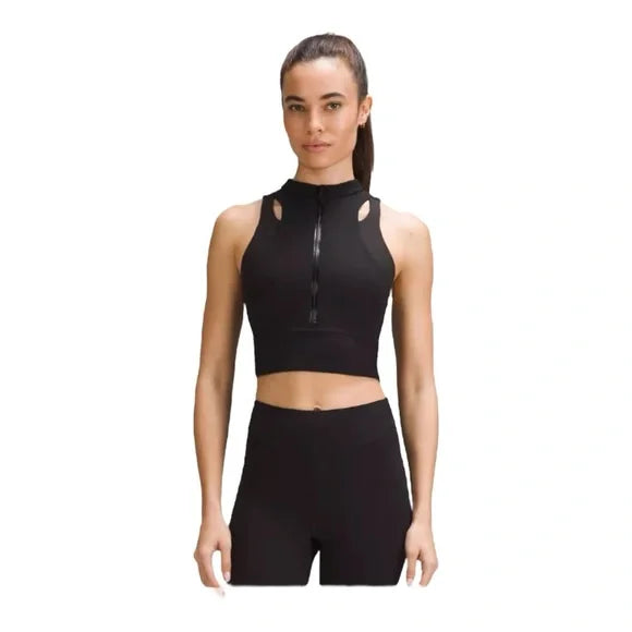 Black Nulux cropped half-zip track tank top with cutouts.