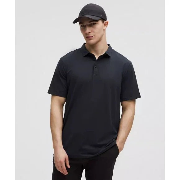 Men's navy short-sleeve polo shirt and black baseball cap.