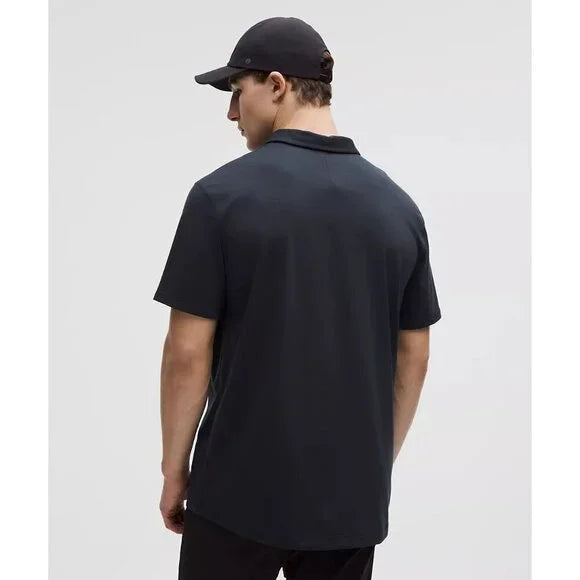 Men's navy short-sleeve polo shirt and black baseball cap.