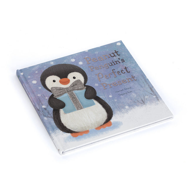A children's book titled "Peanut Penguin's Perfect Present" features a penguin holding a gift.
