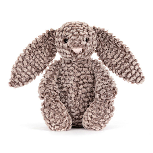 A plush, textured brown bunny with long floppy ears sits facing forward.