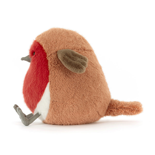 A plush toy robin with a red breast, brown back, and gray feet sits facing left.