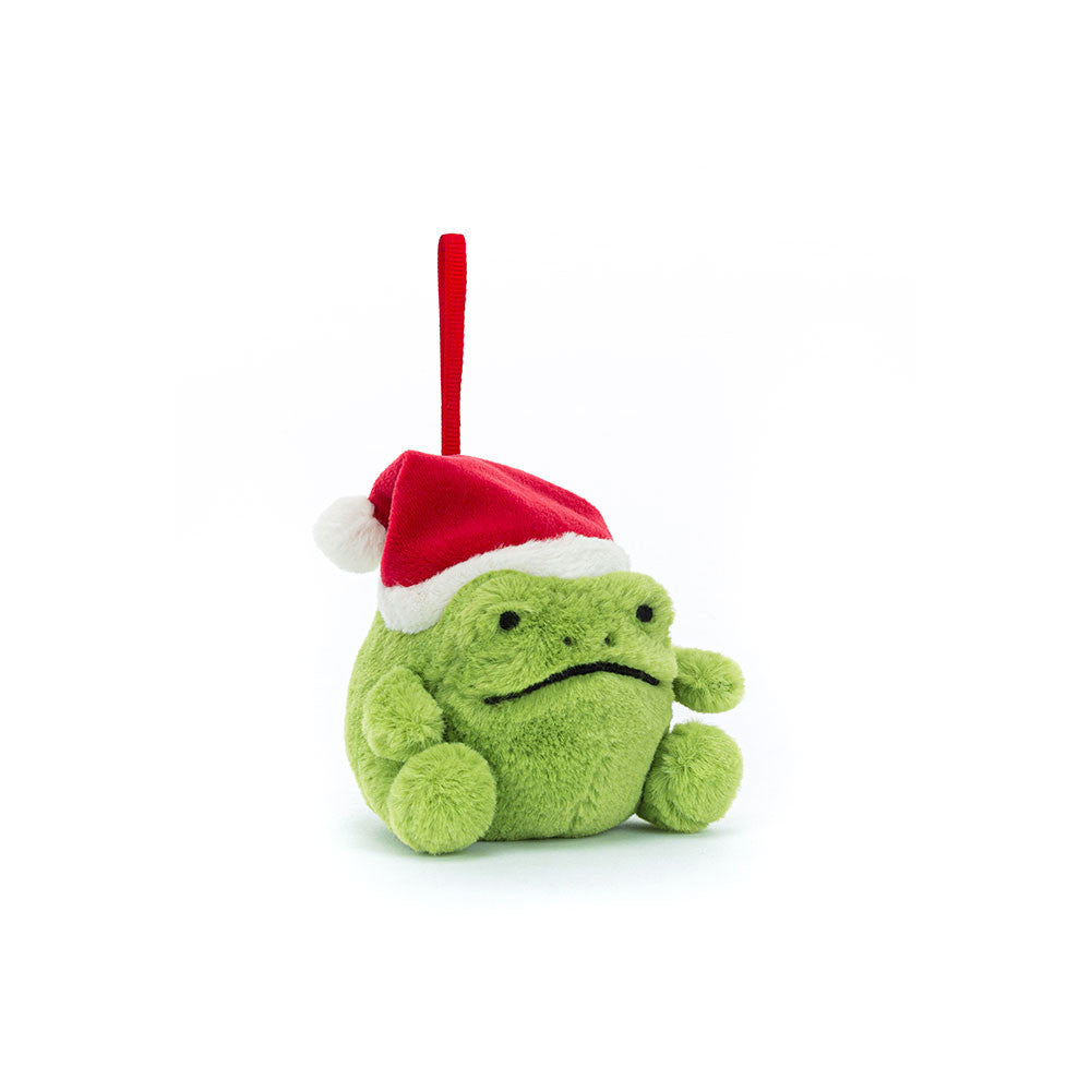 A plush green frog ornament wearing a red Santa hat with a white pompom.