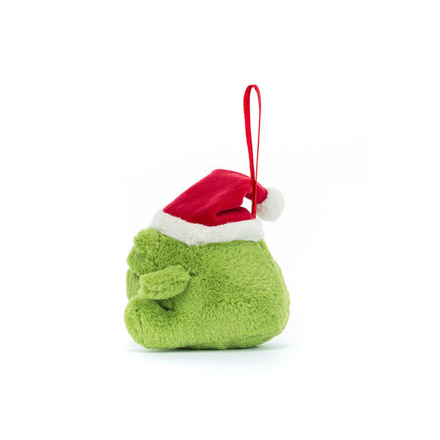 A plush green frog ornament wearing a red and white Santa hat with a red ribbon loop.