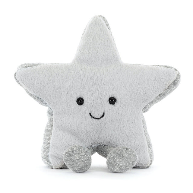 A plush silver star with a smiling face and small feet sits upright.