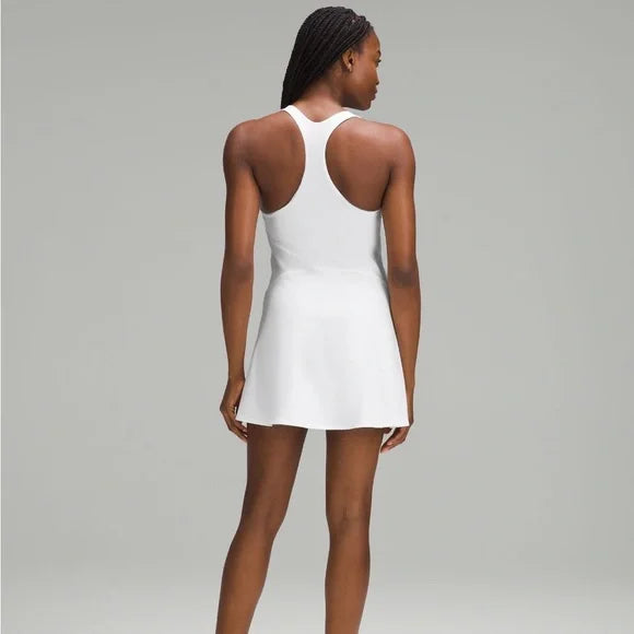 A white, sleeveless tennis dress with a racerback.