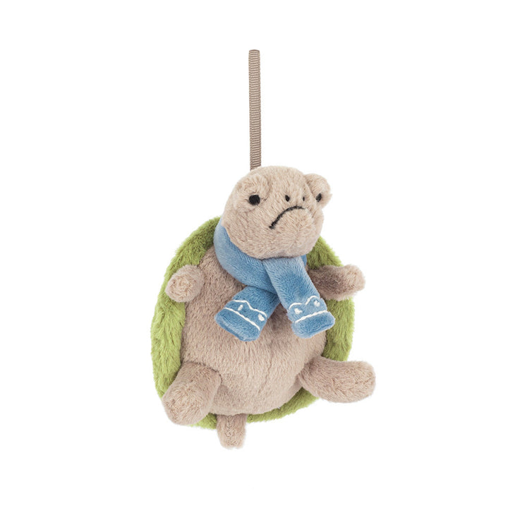 Plush turtle ornament with a grumpy expression and a blue scarf.
