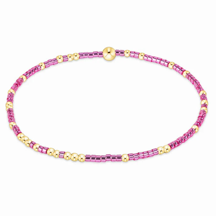 Pink metallic seed bead bracelet with gold-filled beads.